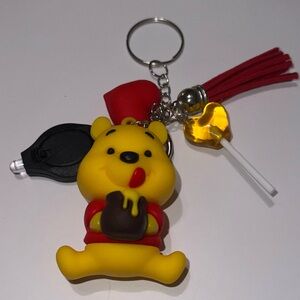Winnie the Pooh charmed keychain with mini flashlight